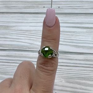 Two tone ring with green center stone. Size 8
